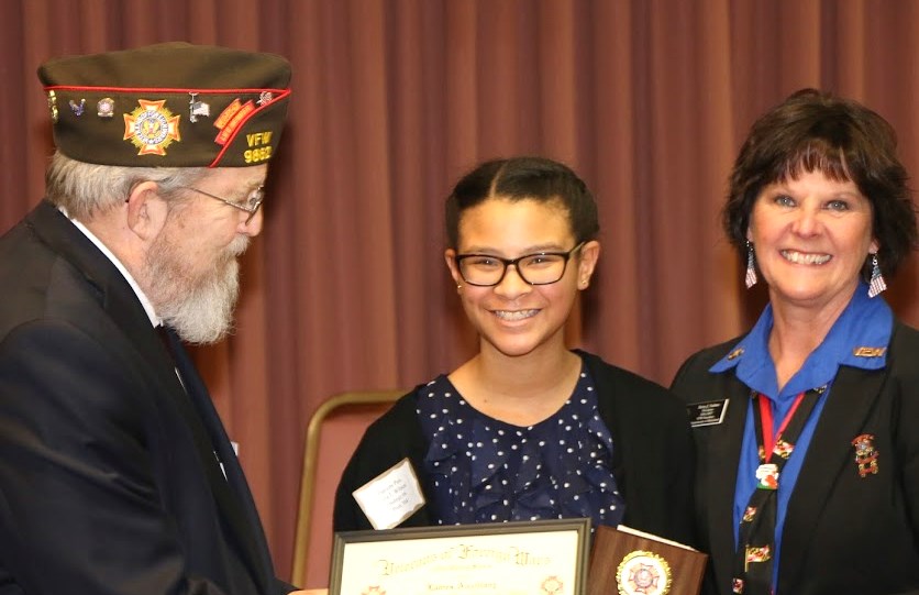 State Commander and President awarding citation and monetary award to a young lady for placing in the Patriot's Pen Contest. 